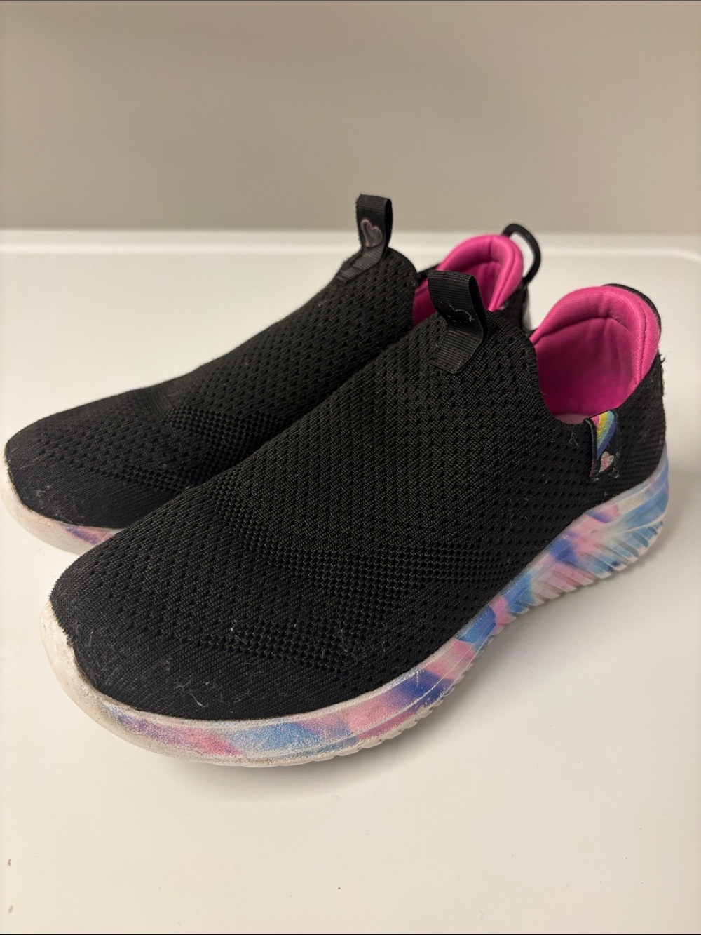 Skechers Kids Black Slip-On Sneakers with Pink Lining and Multicolor Sole